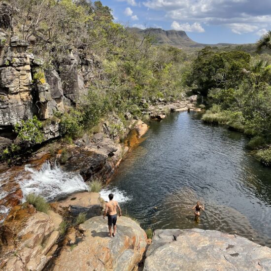 Waterfalls surrounded by lush greenery in Chapada dos Veadeiros